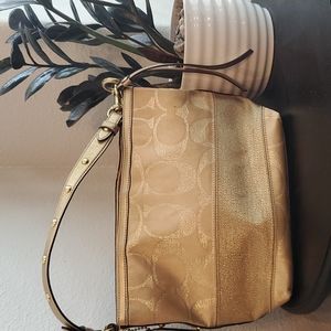 Gold coach bag